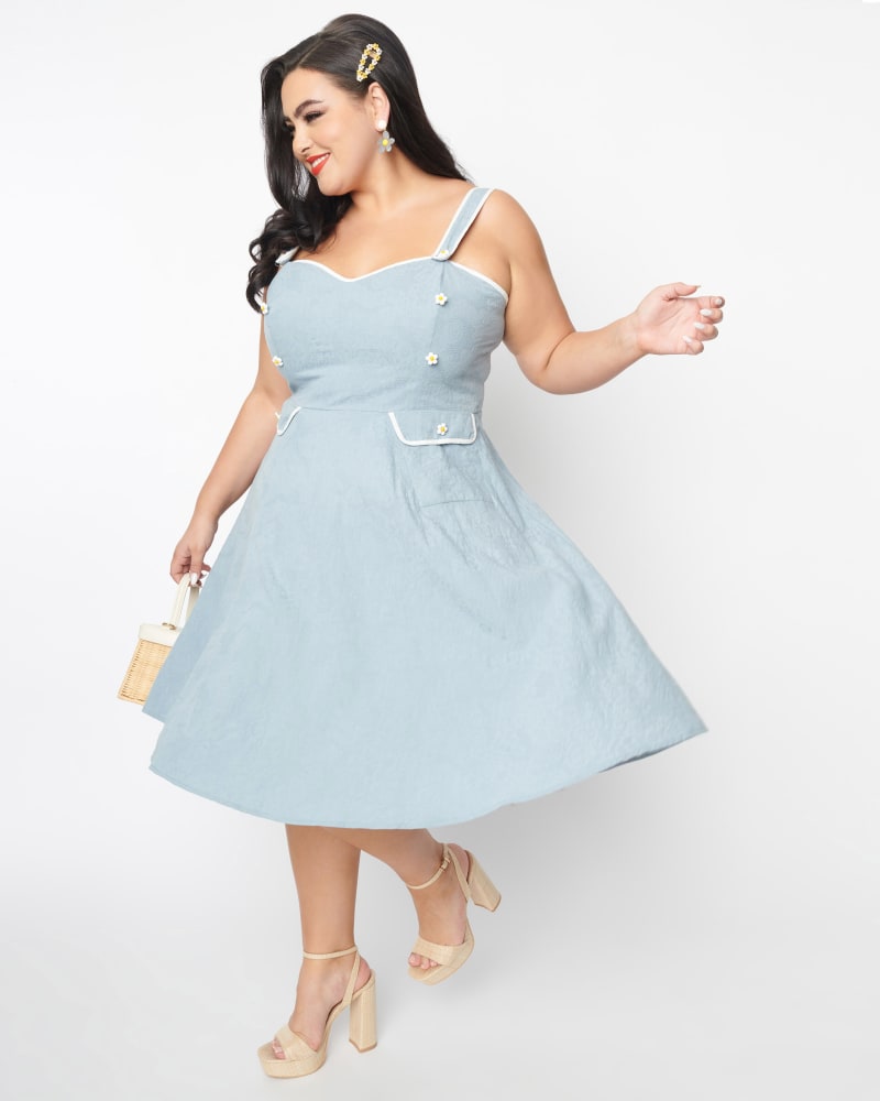 Front of a model wearing a size 2X Unique Vintage Dusty Blue Daisy Pinafore Swing Dress in Blue by Unique Vintage. | dia_product_style_image_id:298591